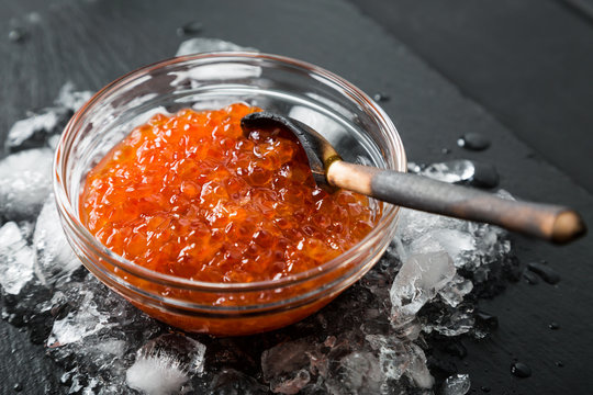 Salted red caviar on ice