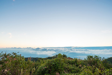 Fototapeta na wymiar Sunrise on peak of mountain with fog white cloud