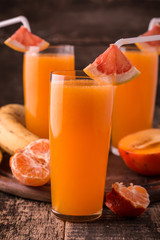Fresh organic moothie with banana, pumpkin ,persimon, orange,healthy drink. Vegan snack