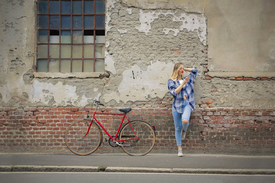 Urban girl with red bike