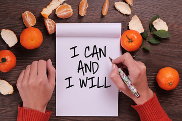 Motivation words I can and I will, inspiration quote. Woman writing affirmation close up. Success,...