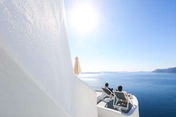 bride and groom relaxing and enjoying sea view