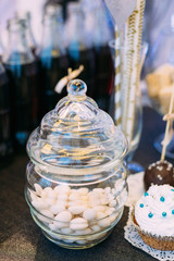 Dessert Sweet Tasty White Glazed Nut Candies in Candy Bar On Tab