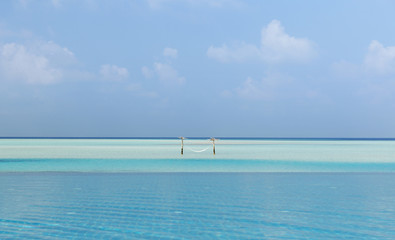 hammock in water on maldives beach