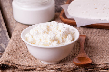 cottage cheese in a white bowl on a wooden table