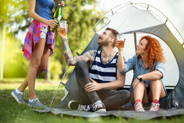 Friends toasting at camp