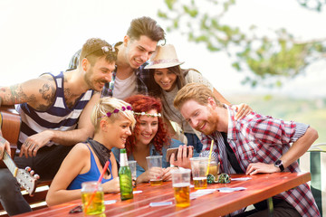 Youngsters watching their photos on mobile