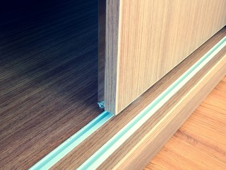 Close up of slide wooden door and rail