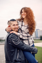 Fototapeta premium Young and happy couple having fun in the city