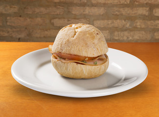 Brazilian snack pao de queijo (cheese bread) on white plate with