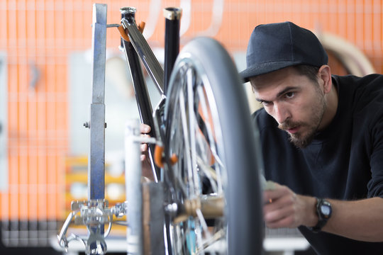 Professional craftsman assembling his creation