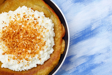 Pancake with cottage cheese and grated coconut topping