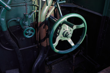 Details of a vintage steam train driving cabin.