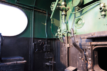 Fototapeta na wymiar Details of a vintage steam train driving cabin. Darjeeling train.