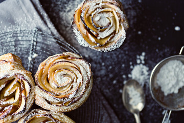 mini apple roses puff pastry with icing sugar.