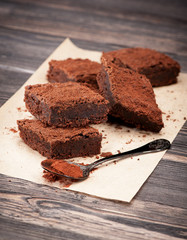 Fototapeta na wymiar chocolate cake brownies on a wooden background