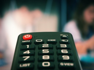 TV remote control with television background