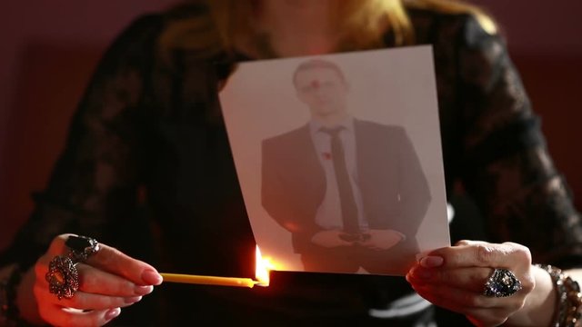 woman holds a ritual of black magic. spell men. He uses photography.