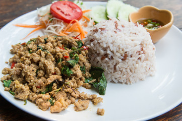 Rice topped with stir-fried pork and basil