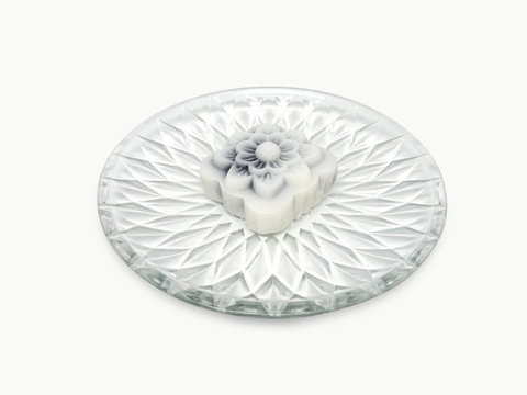 White Snow Lotus Cake On A Glass Plate