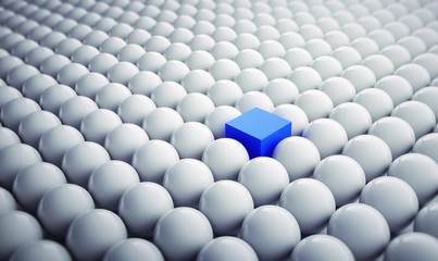 Blauer Würfel in Gruppe weißer Kugeln 1