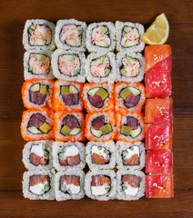 Japanese food. Assorted sushi on a wooden table, top view
