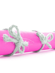 Natural handmade rope knots tied on pink letter roll isolated