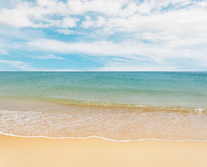 Fototapeta na wymiar Blue sea with white sand beach on blue sky