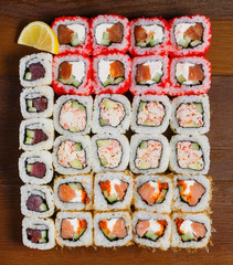Japanese food. Assorted sushi on a wooden table, top view