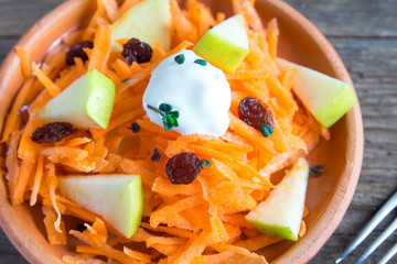 Carrot and apple salad with raisins