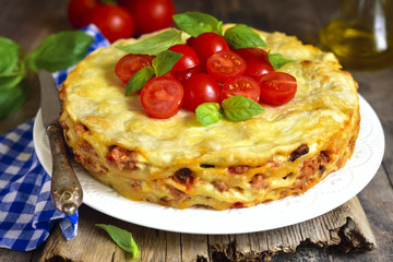 Lasagna pie with chicken and dried mushrooms.