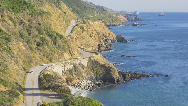 Zooming out view from above of California Highway 1 (aka Cabrillo Highway or Pacific Coast Highway) in the Big Sur area of Central California.