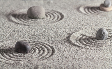 Fototapeta na wymiar Stones and circles in the sand.