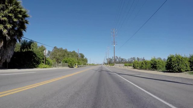 Rural California citrus groves driving on Highway 118 in scenic Ventura County.