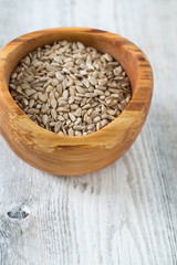 sunflower seeds in a wooden bowl