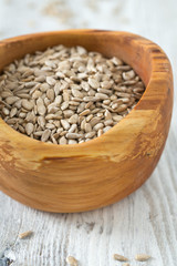 sunflower seeds in a wooden bowl