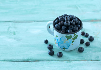 blueberry on wooden surface