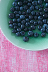 blueberry on wooden surface