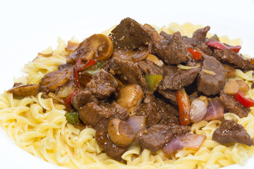 pasta with meat and mushrooms with tomato sauce