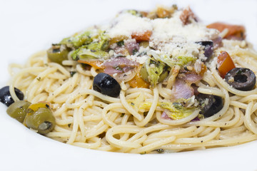 Spaghetti with vegetables and basil olives and cheese