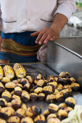 Man roasts chestnuts