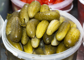 Pickled cucumbers in a bucket on the market
