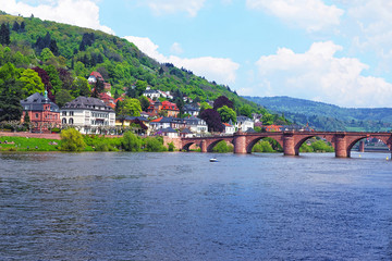Quay of Neckar river and Old bridge in Heidelberg