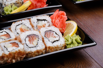 Japnes food. Sushi roll with salmon and squid, on plate