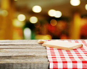 Background with wooden table with cutting board