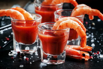 Boiled shrimp with tomato chili sauce, black background, selecti