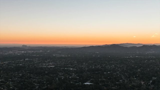 Los Angeles sunset to night hilltop view time lapse with zoom out.