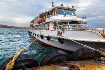 Passangers'  boat, moored by the pier, Istanbul, Bosphorus channel.