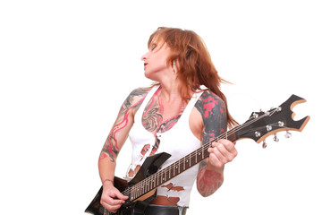Obraz premium Attractive redhead punk girl with tattoos playing electrical guitar