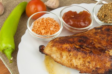 Chicken steak with vegetables. Grilled chicken breasts. Dietary meat on the grill. Chicken fried steak. 
